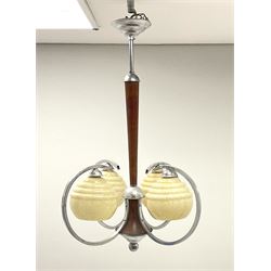 An Art Deco style four branch ceiling light fitting with marbled effect glass shades, upon a chrome and wooden fitting, H72.5cm. 