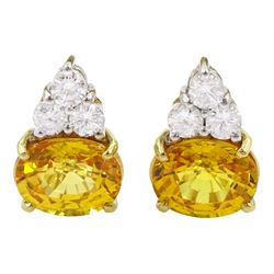 Pair of 18ct white and yellow gold round brilliant cut diamond and oval cut yellow sapphire earrings, total sapphire weight approx 5.40 carat, total diamond weight approx 0.65 carat