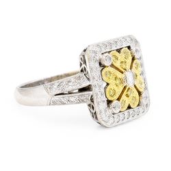 18ct white gold diamond flower head dress ring, milgrain set with sixty-five fancy yellow and white diamonds, with diamond set shoulders, stamped 750, total diamond weight 1.00 carat, with World Institute Report