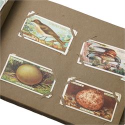 Two cigarette card albums and contents of various cards