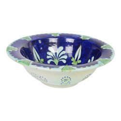 After Torquato Castellani, tin-glazed earthenware bowl, with a floral design the the centre, marked beneath, D19cm 