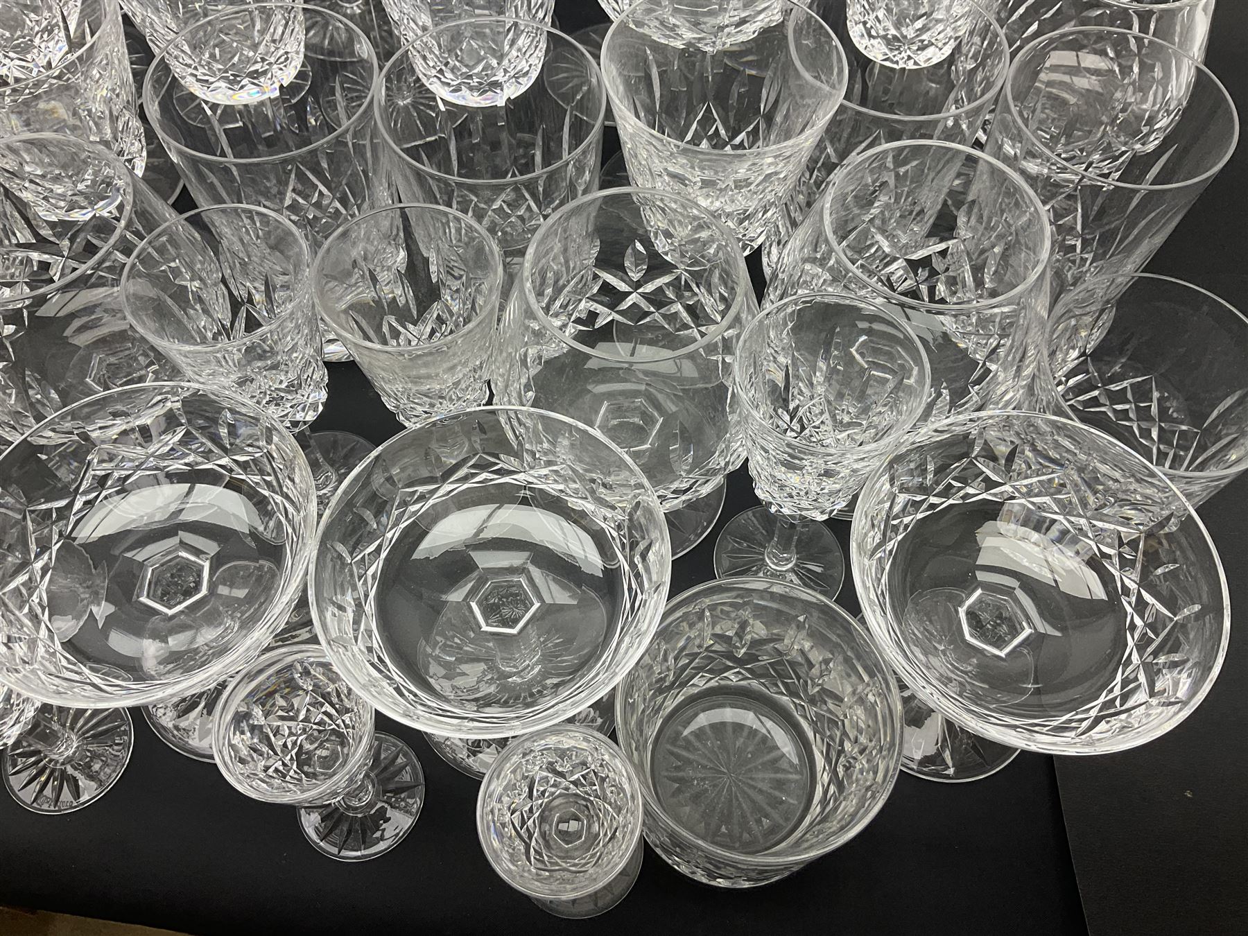 Set of Waterford Crystal Lismore pattern drinking glasses for six people, including hock glasses, goblets, champagne flutes,  sherry glasses, liqueur glasses, hi ball glasses, whisky glasses, brandy balloons, etc, all with etched maker's mark beneath  (62)