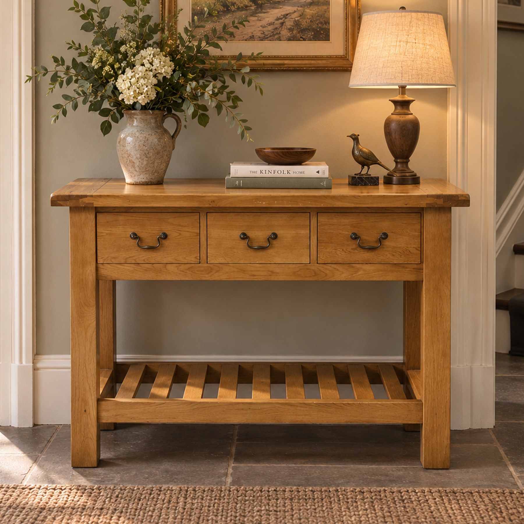 Contemporary golden ash and oak side table, rectangular top fitted with three drawers with swan-neck handles, on square supports united by slatted under-tier