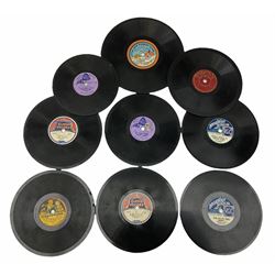 Gebruder Bing Germany Pigmyphone child's portable toy gramophone in woodgrain finish tin-plate box with key and tin of needles L15cm; and nine small records of nursery rhymes; together with a Japanese tin-pate 'Skip Rope Animals' clockwork toy, boxed.