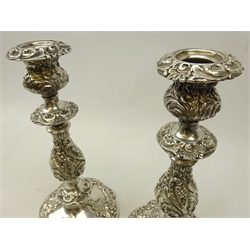  Pair 19th century silver-plated candlesticks allover embossed with stylised foliate and scrolls, H27cm   