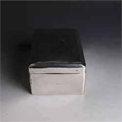 Two silver cigarette boxes, comprising early 20th century plain rectangular example with compartmentalised softwood interior, hallmarked Birmingham 1914, maker's mark indistinct, and an early 20th century example with engine turned decoration and engraved initials to cover, hallmarks worn and indistinct, largest H4.5cm, W21cm