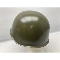 Two 1960s East Block Soviet style helmets - Czechoslovakian and Russian; both with liners (2)