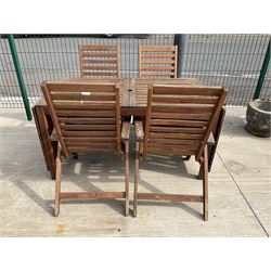Rectangular teak drop leaf garden table, and four slatted armchairs