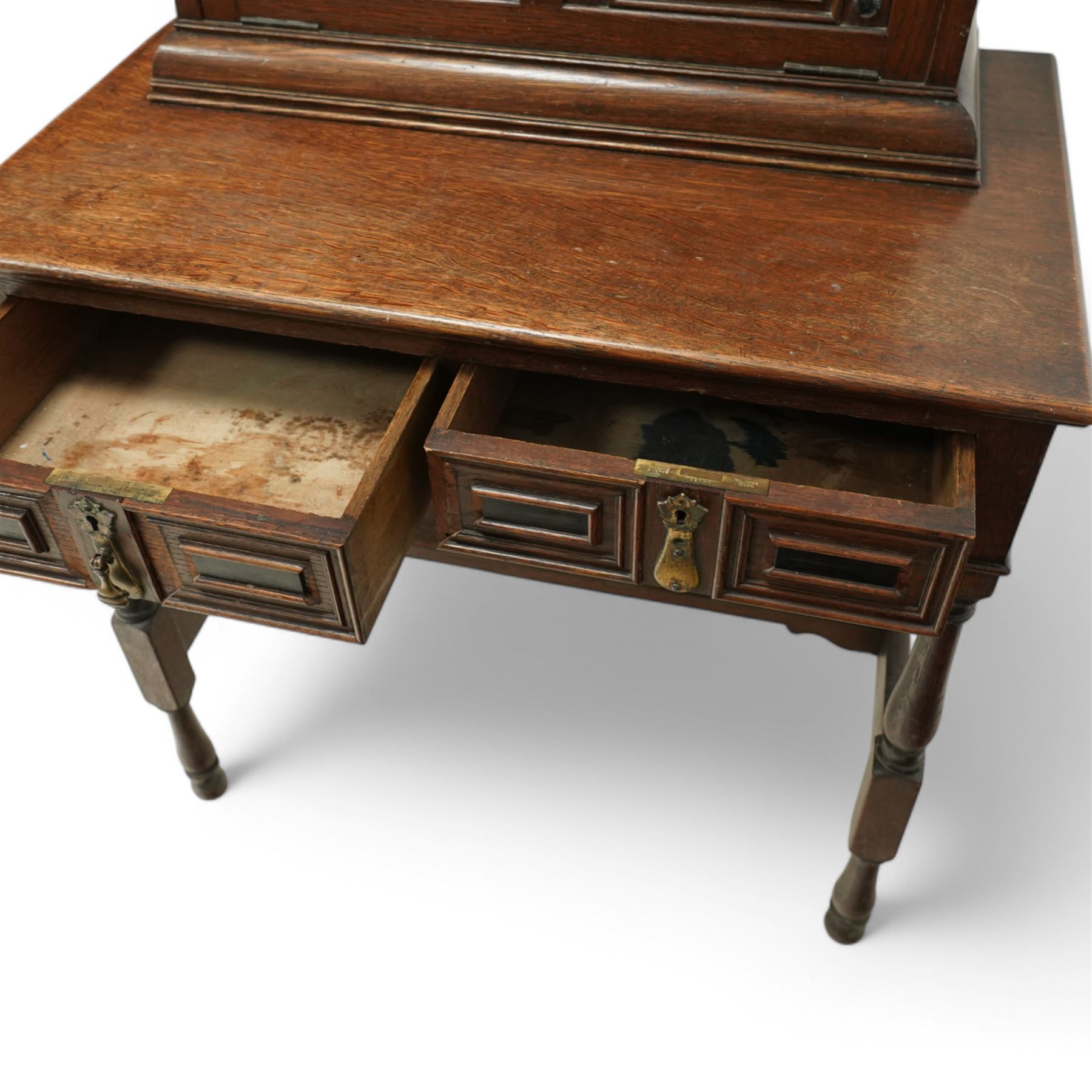 Late 19th to early 20th century Bonheur de Jour or writing bureau, the upper section enclosed by fall front decorated with geometric mouldings and oval inlaid panels depicting floral urns and swags, fitted with document divisions and two small drawers, the lower section fitted with two drawers with applied mouldings, on turned supports united by undertier, 'Hobbs & Co of London' locks