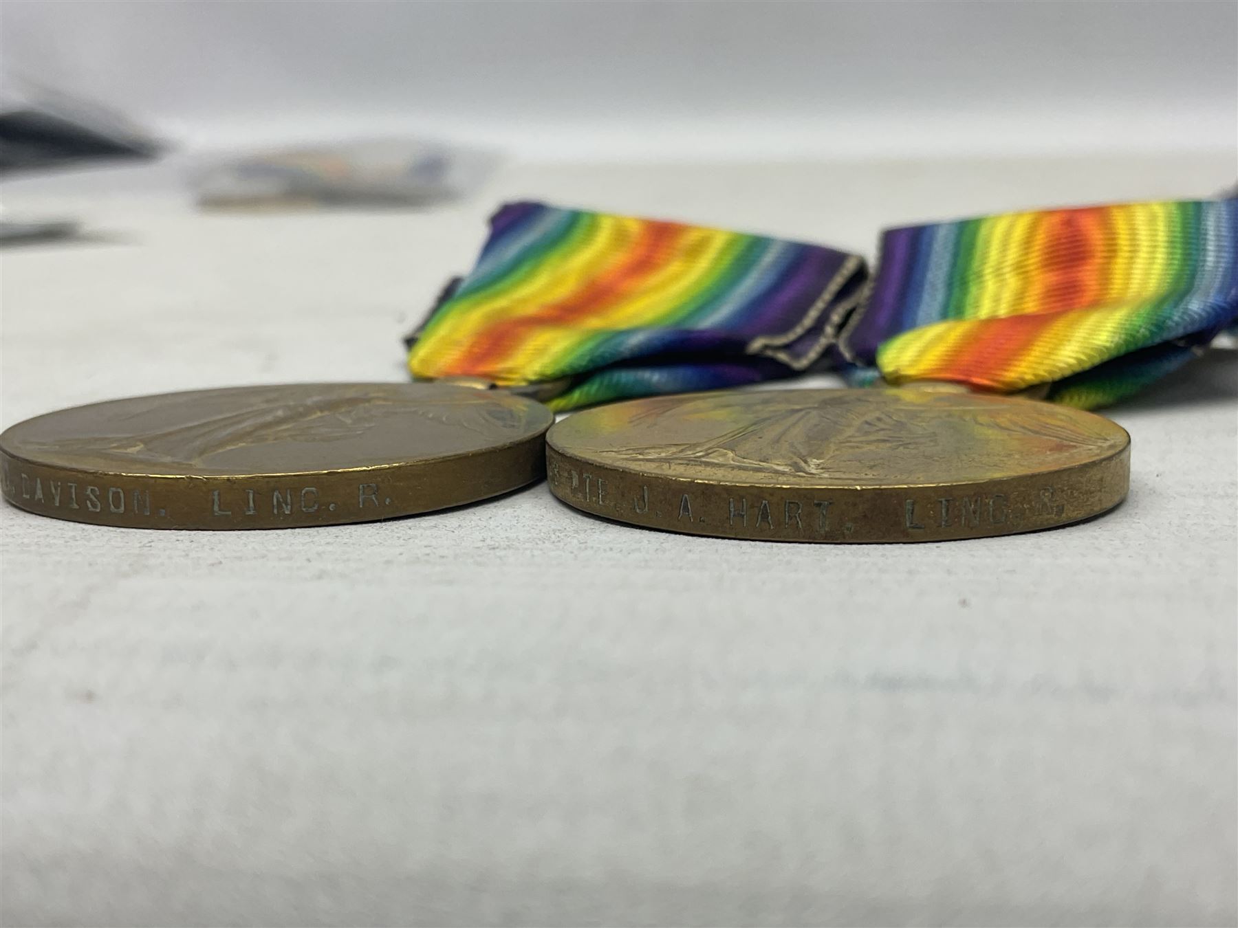 Five WW1 Lincolnshire Regiment Victory Medals awarded to 42327 Pte. T Davison; 29878 Pte. J.W. Simpson; 21702 Pte. H. Archer; 41348 Pte. J.A. Hart; and 9874 Pte. N. Ellis; some biographical information; all with ribbons (5)