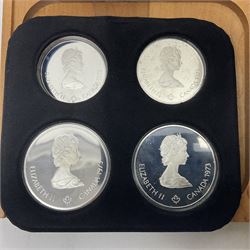 Six Queen Elizabeth II The Royal Canadian Mint silver proof four coin sets, to commemorate the 1976 Montreal Olympic Games, each set containing two five dollar coins and two ten dollar coin with Queen's head obverse and designs to the reverse relating to the Olympic Games, all in the original display cases and outer card boxes with certificates