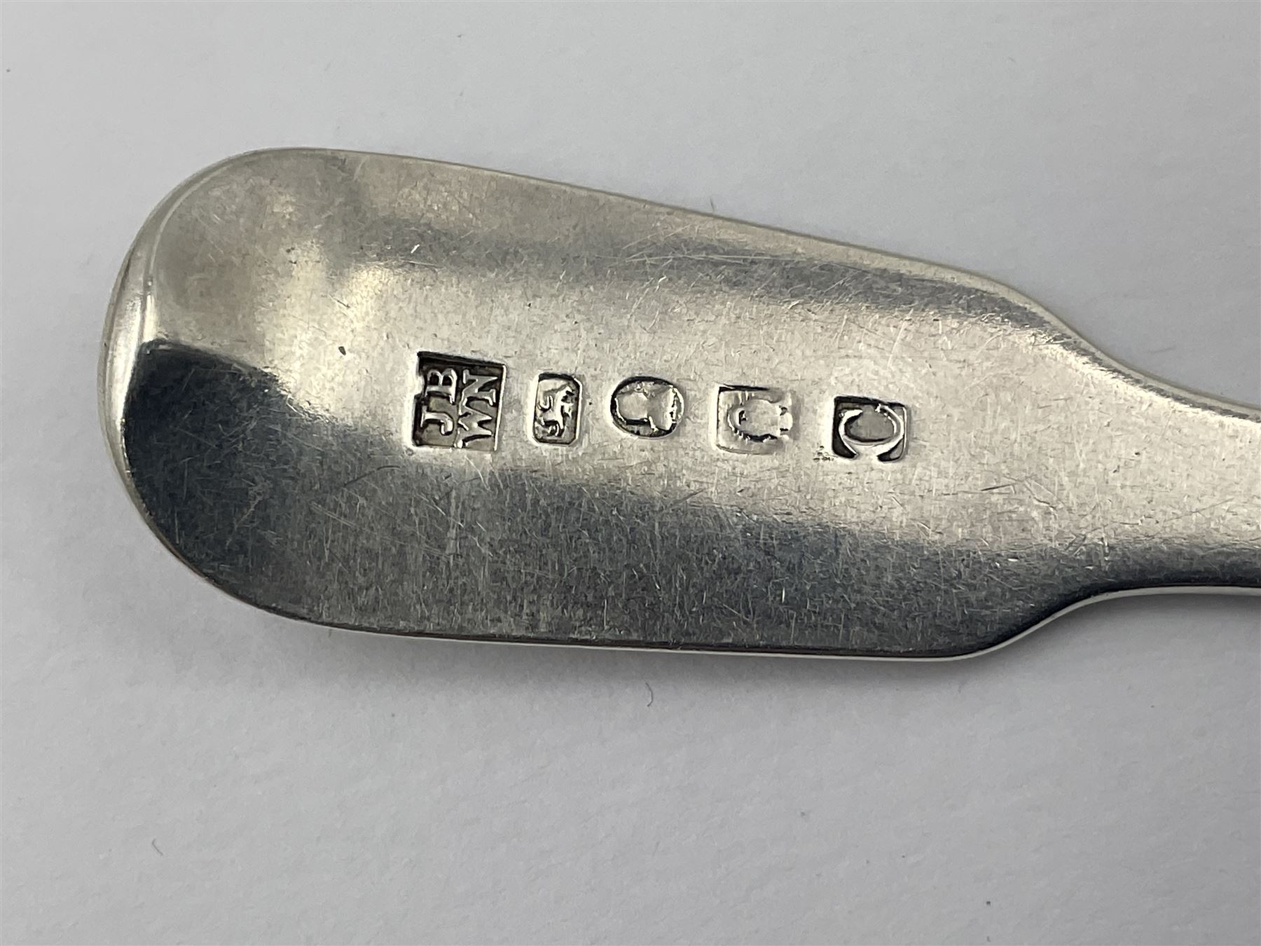 Pair of George III York silver Fiddle pattern dessert spoons, each engraved with a rampant lion crest, hallmarked James Barber & William North, York 1789