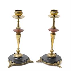 Pair of brass and slate candlesticks in the Egyptian style, the stems decorated with raise...