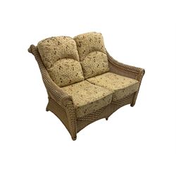 Four piece cane conservatory suite - two seat sofa (W130cm), pair of armchairs (W85cm), and coffee table (85cm x 60cm)