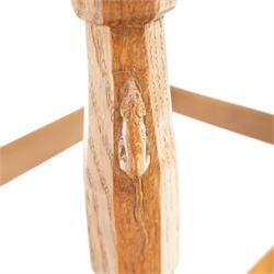 Mouseman - 1950s dark oak dressing table stool, the rectangular top with tan leather seat, raised on octagonal supports united by box stretcher, carved with mouse signature, by the workshop of Robert Thompson of Kilburn