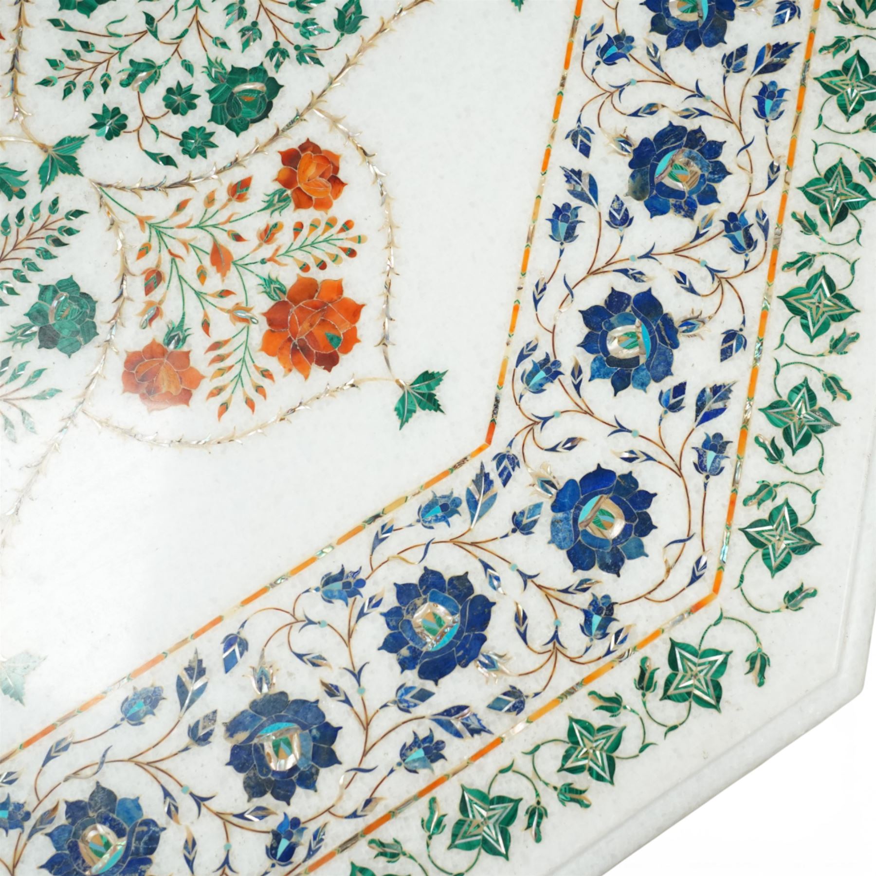 20th century Florentine design composite marble pietra dura centre table, octagonal white marble top inlaid with a polychrome foliate and floral medallion centred by a rosette, within a conforming floral border, raised on a faceted octagonal marble pedestal and stepped base