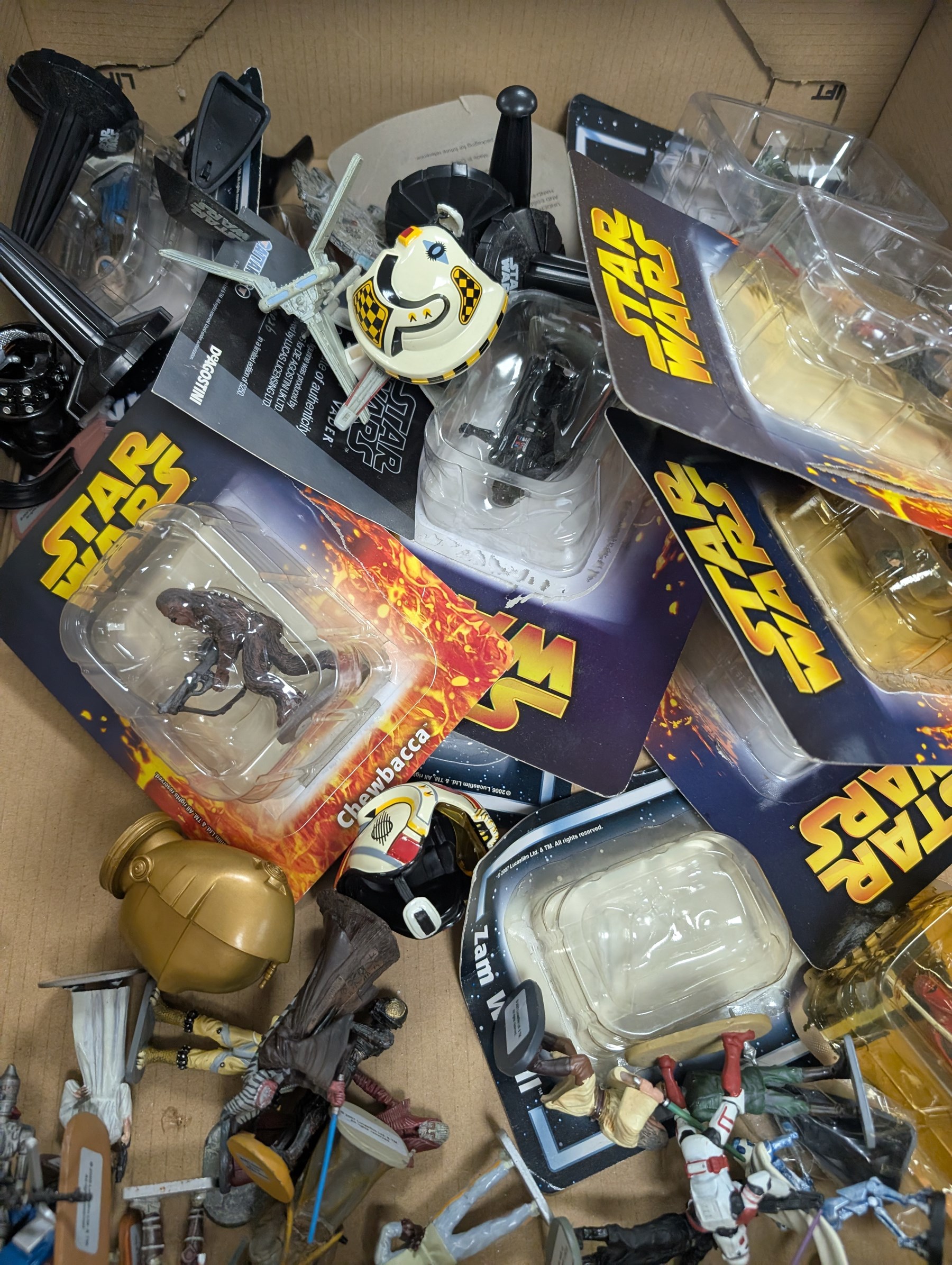 Collection of DeAgostini Star Wars figures, including two limited edition Darth Vader figures, diecast vehicles and figures and miniature helmets