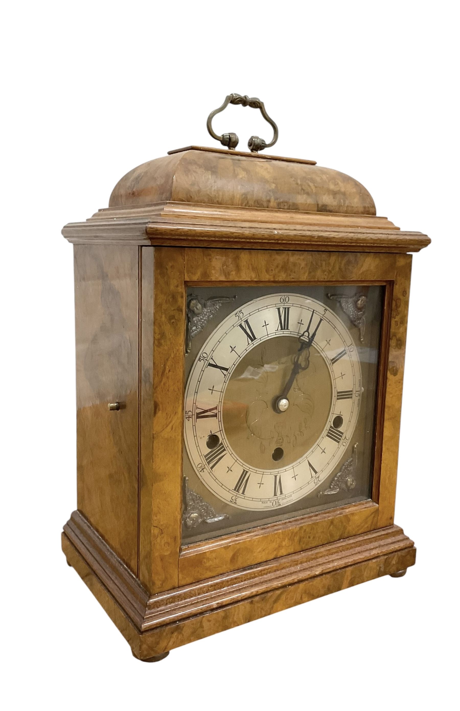 Elliot- late 20th century 8-day walnut bracket clock in an 18th century styled case, with a brass dial, brass spandrels and a slivered chapter ring, three train Westminster chiming movement with a lever balance escapement, chiming the quarters on eight gong rods.