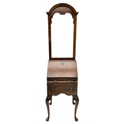 Small early 20th century Queen Anne style bookcase on bureau secretaire, the moulded arched pediment over mirrored door in shaped frame, the bureau fitted with fall front enclosing curved fitted interior, cushion moulded drawer over single drawer, on scroll and shell carved cabriole supports