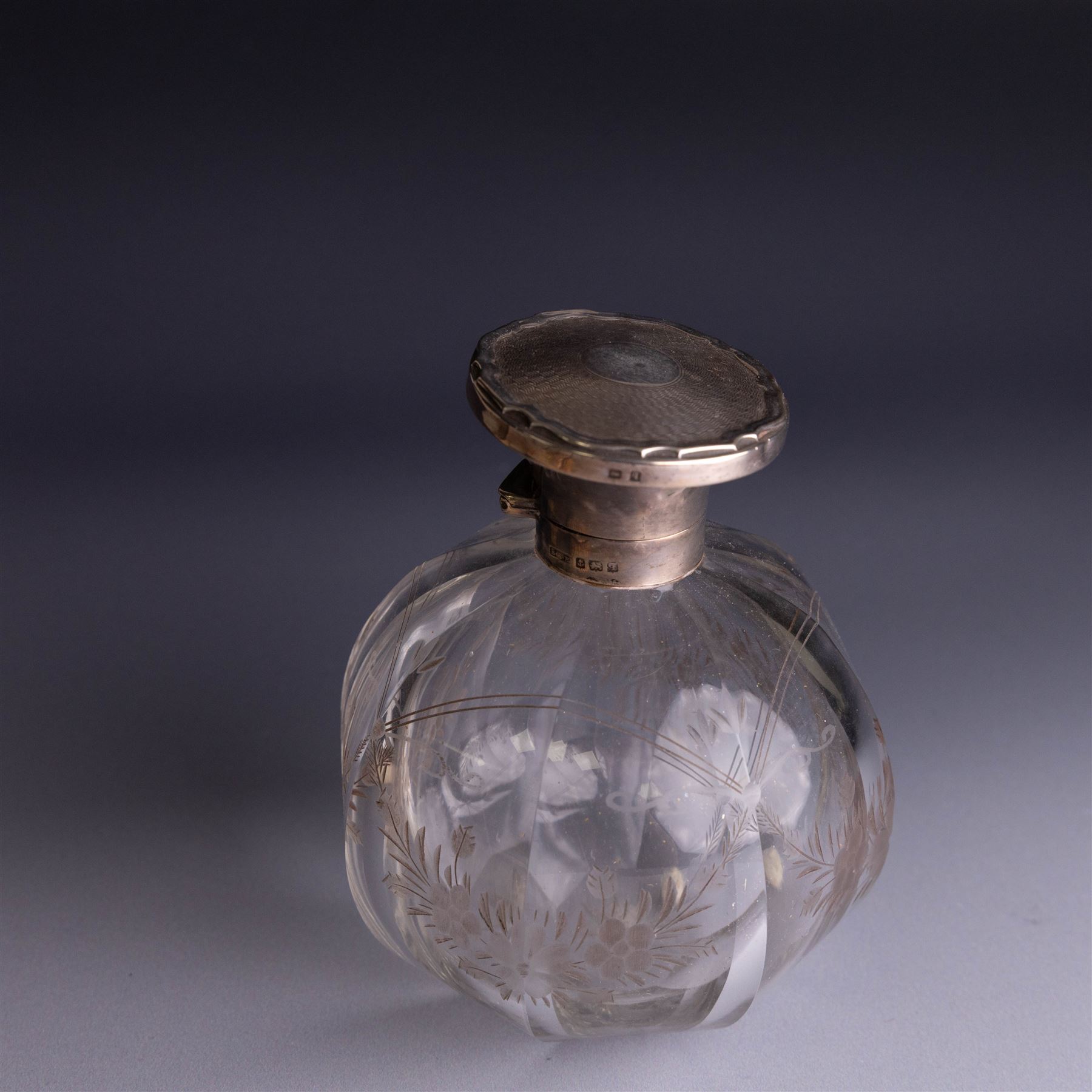 Mid 20th century silver mounted hairbrush and clothes brush, with guilloche enamel floral decoration, hallmarked Adie Brothers Ltd, Birmingham 1960, together with an silver mounted glass scent bottle, the glass with etched floral decoration and engine turned cover, hallmarked 