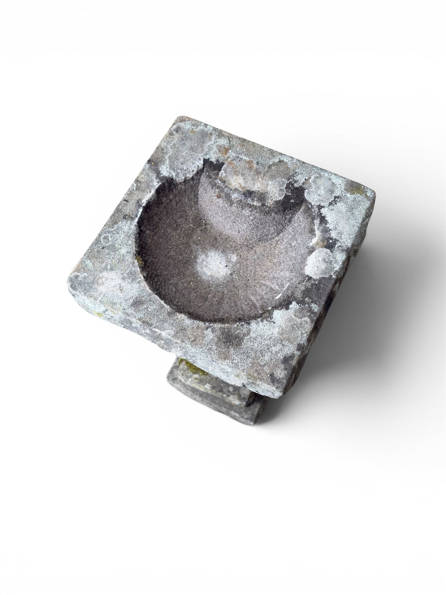 19th century weathered sandstone birdbath, formed in four sections, square top with carved shell bath, raised on tapering column with stepped base