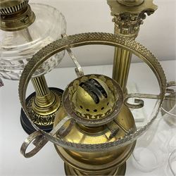 Brass Corinthian column oil lamp, upon stepped marble base, together three other brass table lamps, tallest H68cm