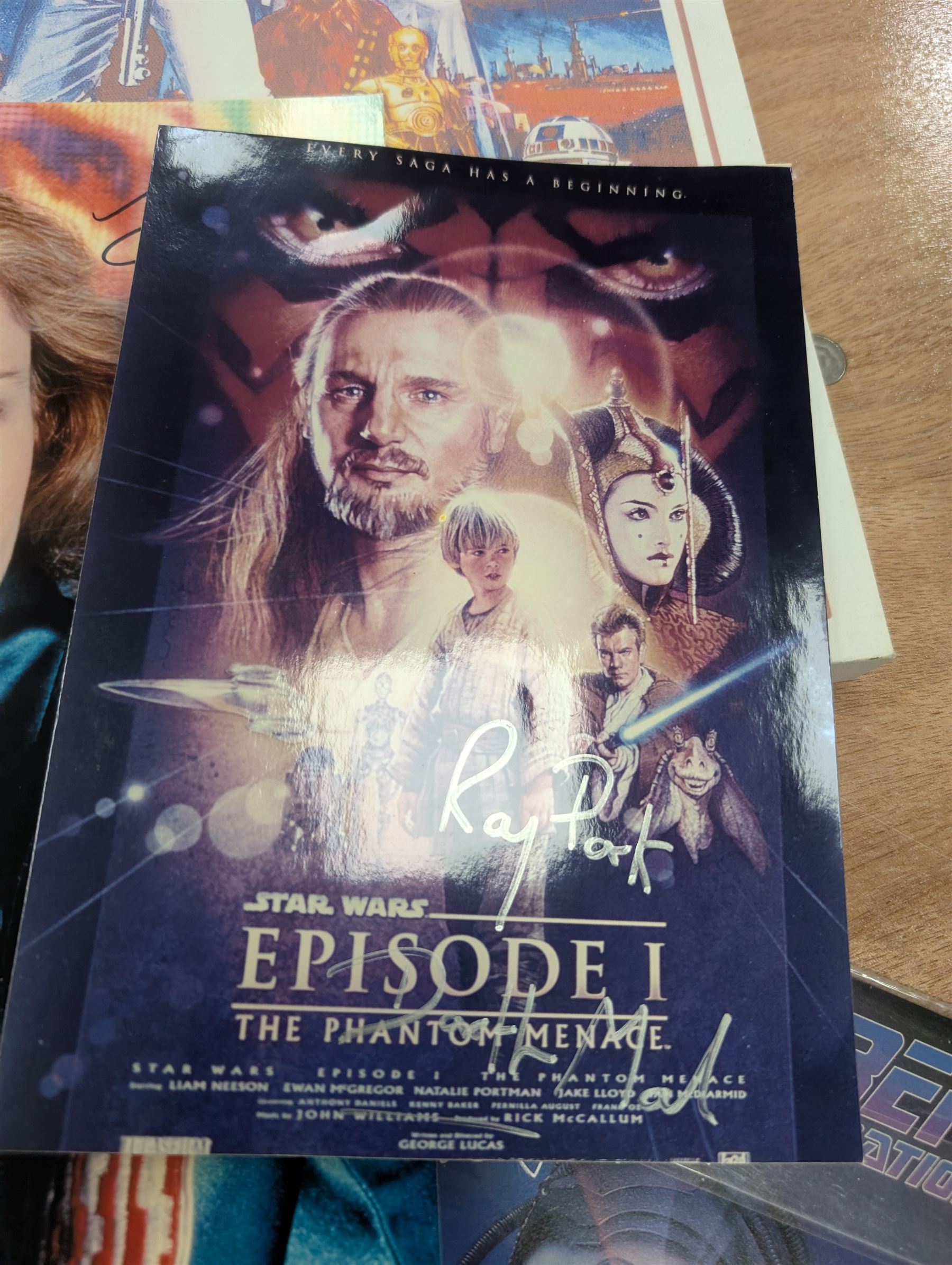 Collection of Star Trek The Next Generation and Deep Space Nine memorabilia, including two limited edition signed Star Trek Deep Space Nine photographs, commemorative porcelain plaque, insignias, Encounter at Farpoint pewter plaque, signed photograph of the Voyager crew, two signed copies of Convergence and a signed War & Madness graphic novel, canvas prints and other signed photos, together with Star Wars Ray Park (Darth Maul) signed photograph, UFO and Buck Rogers memorabilia