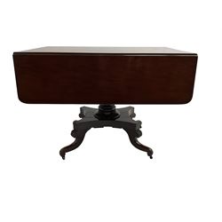 19th century mahogany drop leaf pedestal table, fitted with single drawer, raised on turned column with quadriform base and splayed supports with acanthus decoration, on brass castors