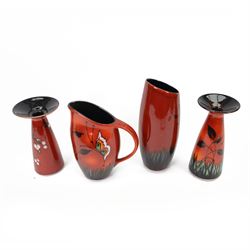 Two Poole Pottery vases decorated in Butterfly pattern, together with matching jug and another Poole Pottery vase decorated in cherry blossom