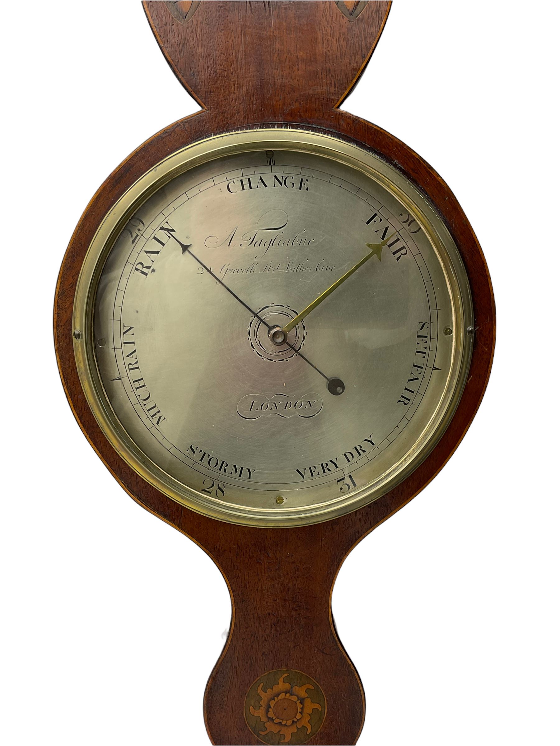 An early 19th century William IV mercury wheel barometer with a rosette inlaid broken pediment