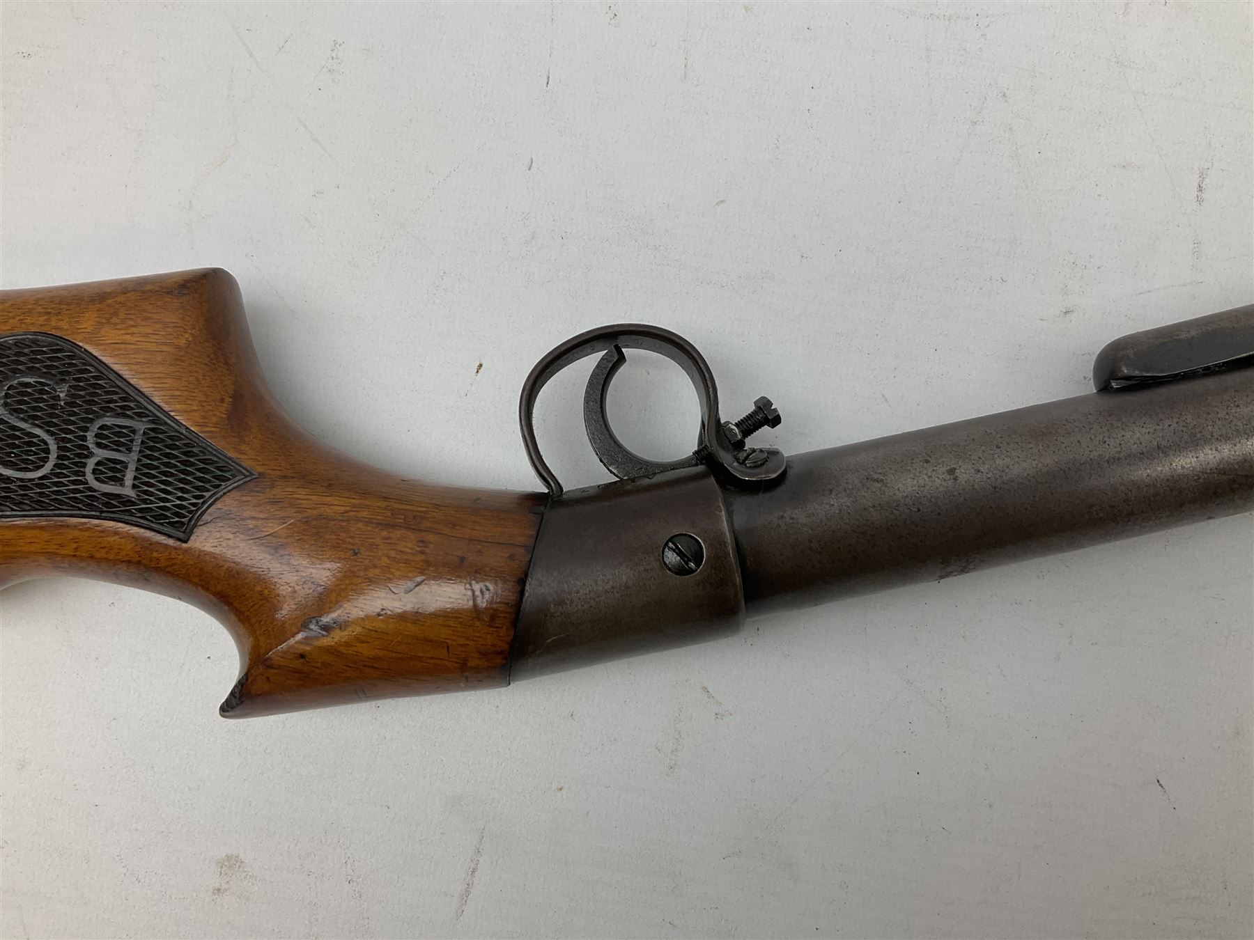 BSA .177 air rifle with top loading under lever action, walnut stock carved with chequered BSA logo to grip, serial no.A1203 L102cm