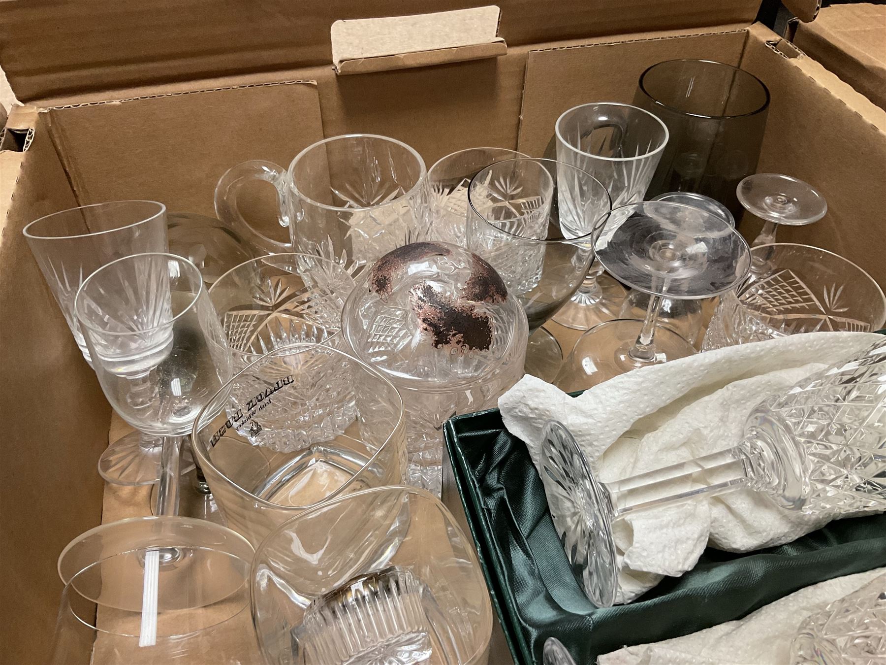 Caithness 'Fireball' paperweight, together with four cased Tyrone Crystal glasses, glass oil lamp, three glass decanters etc, in two boxes