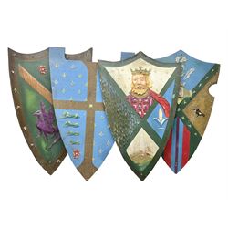 Four decorative painted wooden wall mounting shields, H91cm