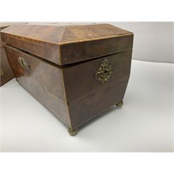 19th century burr yew wood tea caddy, of sarcophagus form, with strung details and brass mounts, the interior split into three compartments, upon four brass bun feet, together with an oak and brass bound writing slope, with red leather interior with gilt detailing, largest H16cm, W40cm