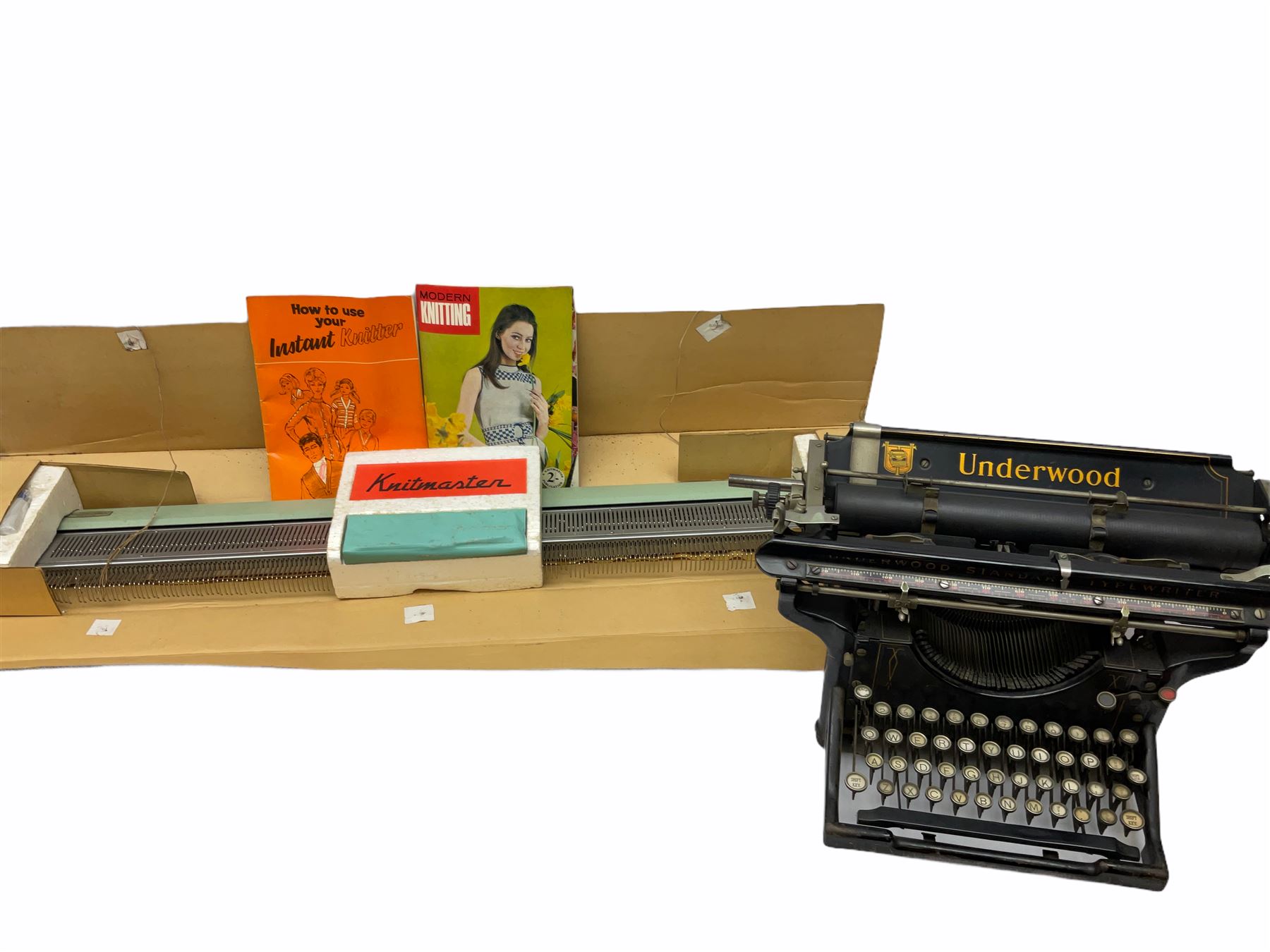 Underwood manual typewriter with original cover and Knitmaster Knitting machine in original box with instructions. 