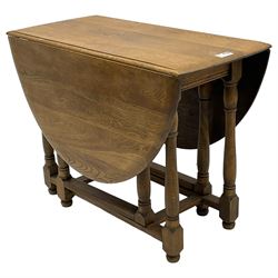 Mid-to-late 20th century oak and beech drop-leaf dining table, gate-leg action base with turned supports