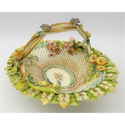  19th century porcelain basket, entwined gilded handle, woven base and floral encrusted flowers, L22cm  