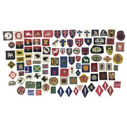 Approximately one-hundred printed and embroidered cloth badges including I, II, VIII, XI, XII and XXX Corps, Eastern Command, various Armoured Divisions, Midland, Wessex, Home Counties and 12th Infantry Brigades, Salisbury Plain, Northumberland, Hampshire, North Midland, West Riding, Essex and Suffolk Districts, Berlin & Rhine Army Troops etc