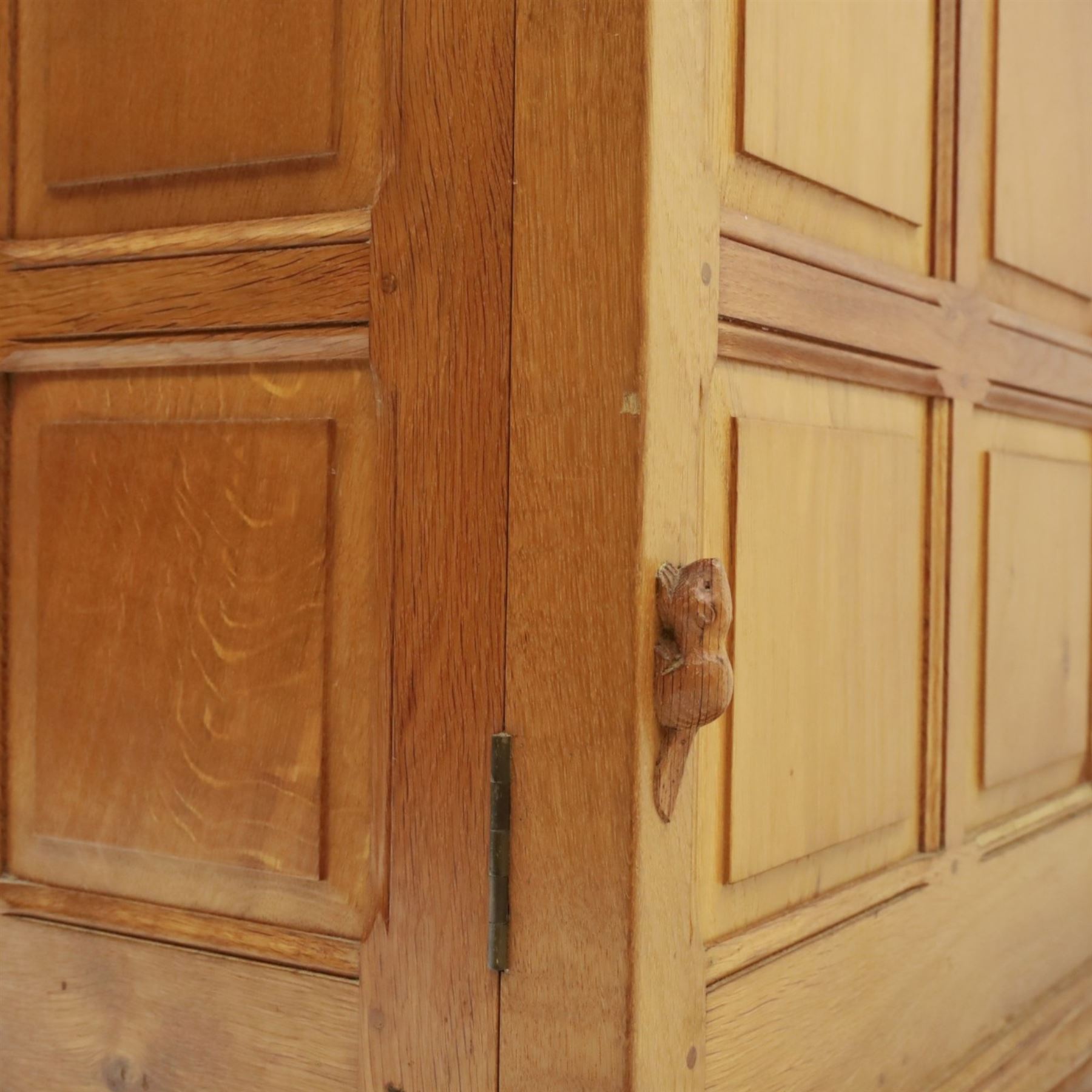 Beaverman - oak double wardrobe, enclosed by twin multi-panelled doors, Yorkshire Rose carved handles, the interior fitted with shelf and hanging rail, with signature carved beaver, by Colin Almack of Sutton, near Thirsk