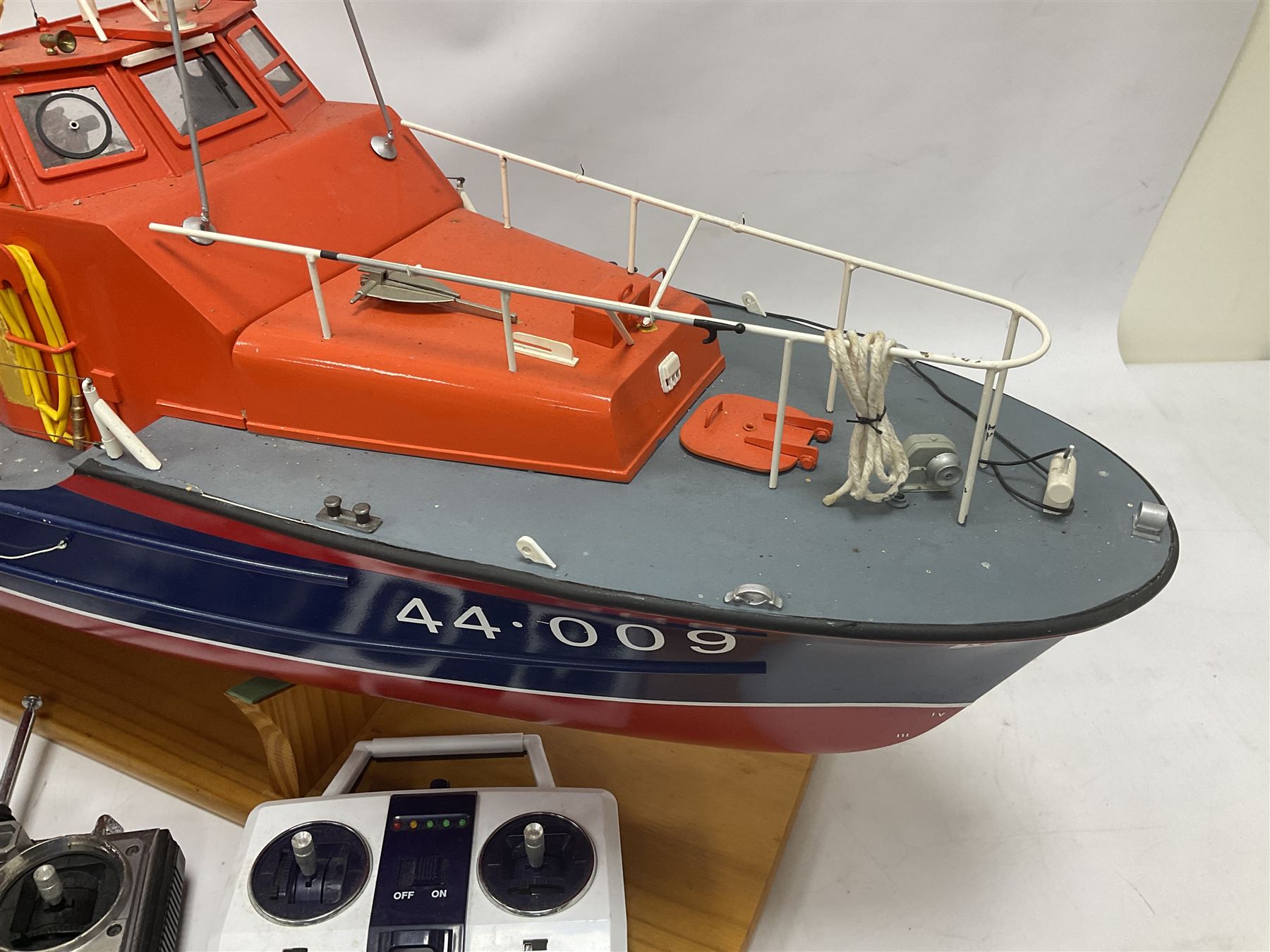 Two remote controlled kit-built plastic model boats - RNLB Sheerness Lifeboat Helen Turnbull L92cm and 'Conserver' Grangemouth L76cm; each on wooden stand; together with three remote control units