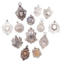 Thirteen silver fobs form, mostly Victorian and Edwardian examples, to include two gold facing examples, and seven double sided examples, various hallmarks, dates ranging 1894 to 1948, approximate total weight 5.50 ozt (171 grams)