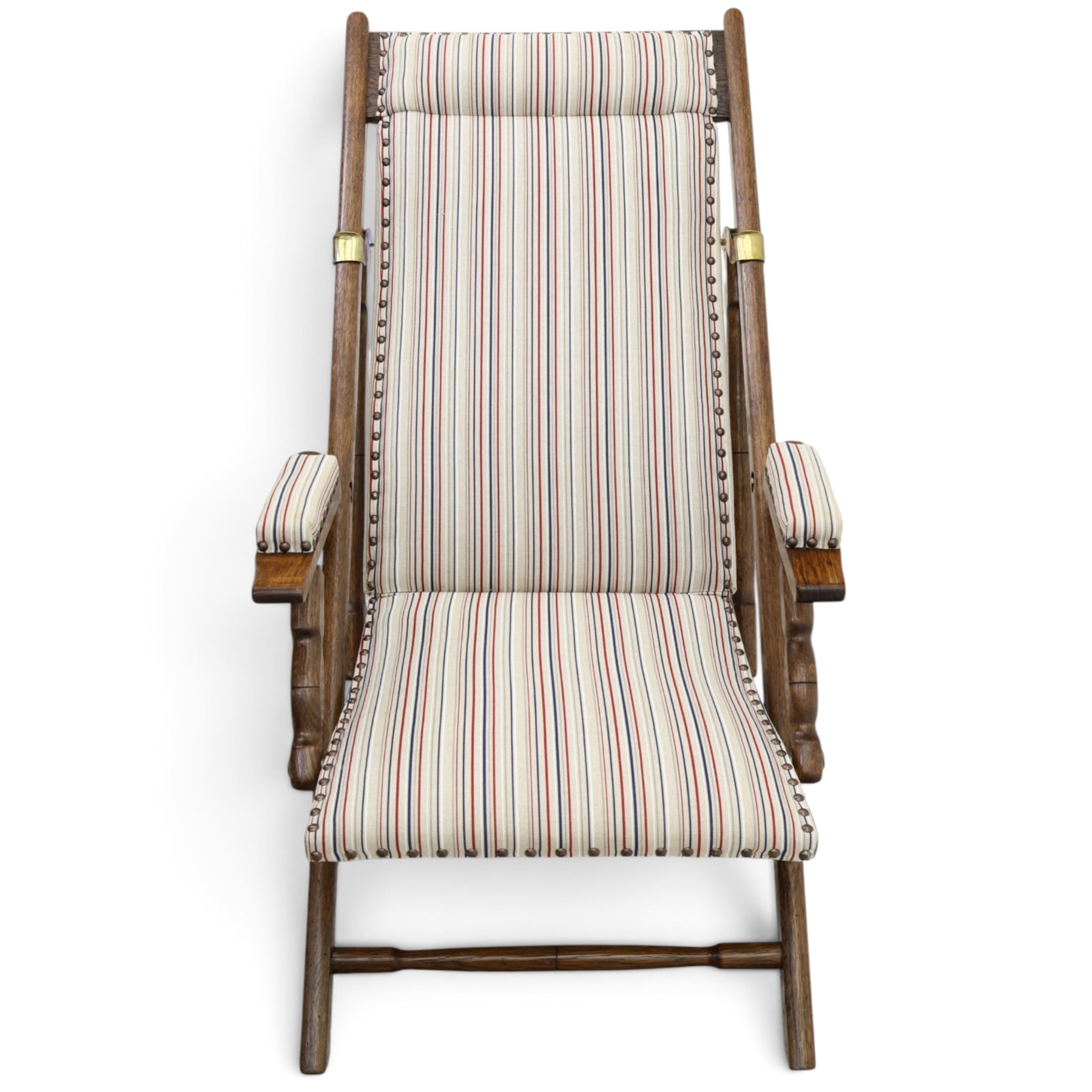 Pair of early 20th century oak framed garden reclining and folding deckchairs, high back and seat upholstered in striped fabric with padded armrests