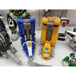 Collection of early 90s Mighty Morphin’ Power Rangers Zords, figures and accessories. Titanus the Carrier Zord, marked Bandai 1991; Green Dragonzord, incomplete; 1994 White Tigerzord with original instruction manual; 1993 Triceratops Dinozord, Mastodon Dinozord and Sabertooth Tiger Dinozord, Pterodactyl Dinozord, missing guns; with 1993 Power Morpher and original Power Coins, with further related figures, accessories and weapons