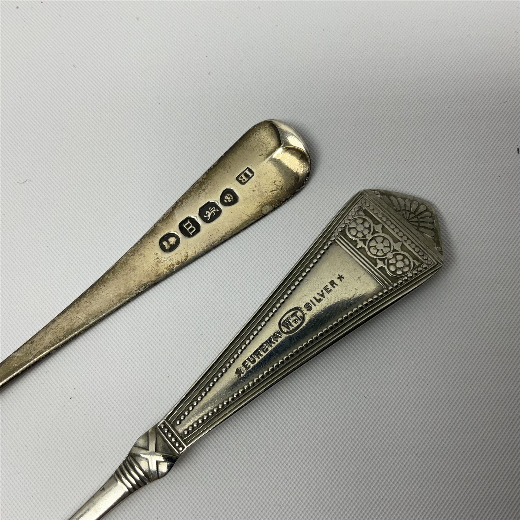 Victorian silver cut glass cruet set on stand, with diamond cut bodies, a set of six silver handled cake forks, cased, a Georgian silver mustard spoon and a silver plated shovel spoon, all hallmarked 