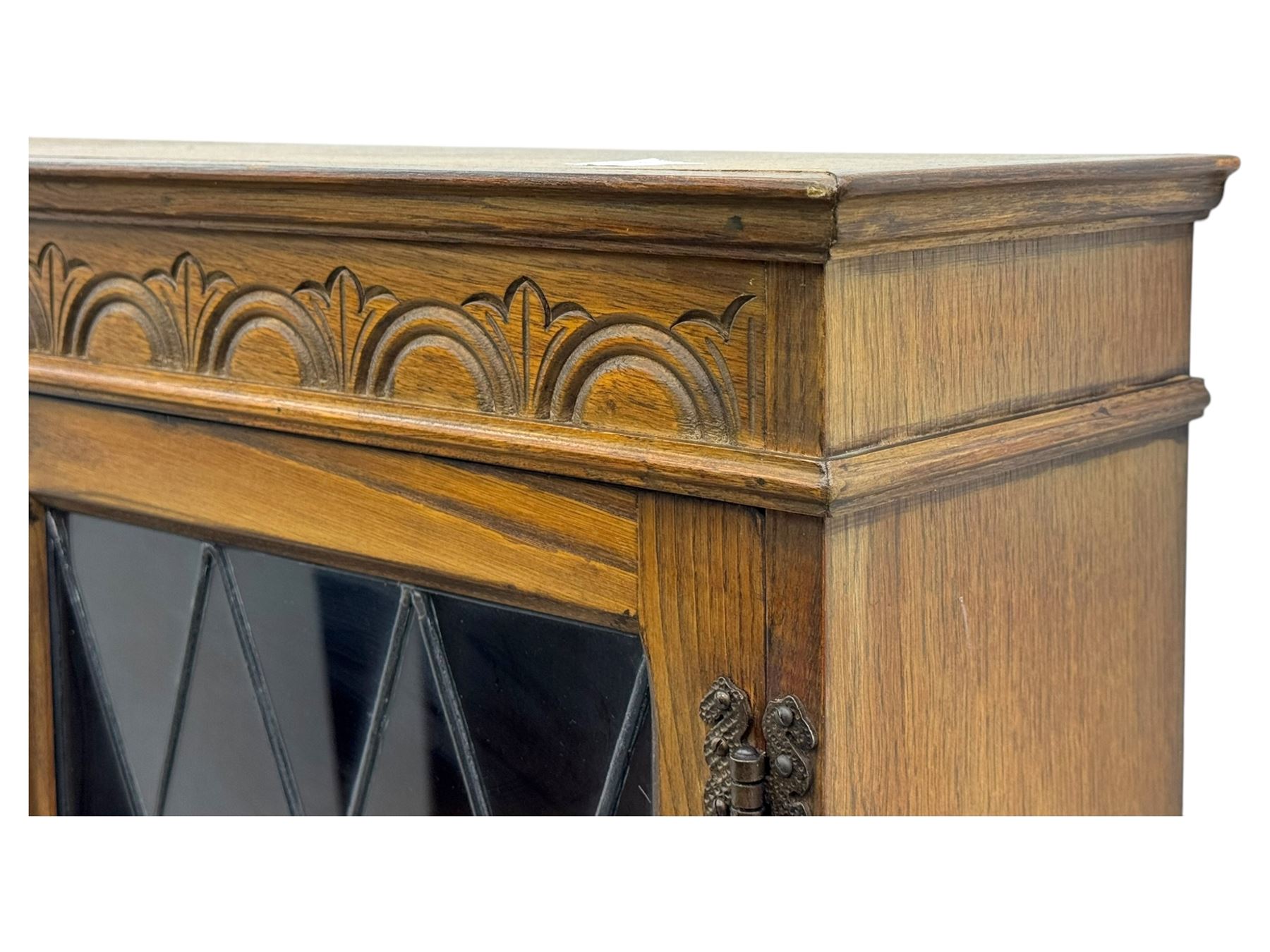 Large mid-20th-century oak dresser with two astragal glazed doors between gallery shelf and lower shelf, with three short drawers and lower section with four drawers and three double-panelled linen-fold hinged cupboard doors 
