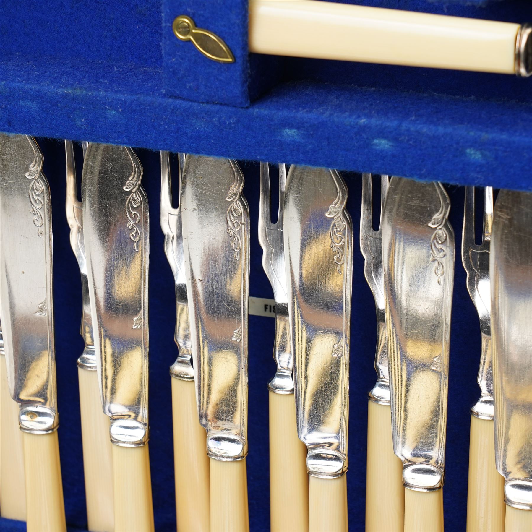 Suite of plated table cutlery for twelve covers including fish cutlery and servers, fruit knives and forks with mother of pearl handles, bone handled knives, carvers etc in an oak  three drawer cabinet with hinged lid W47cm 160 pieces