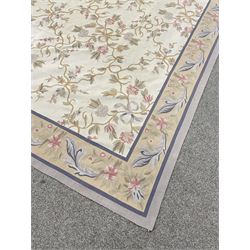 French style Aubusson rug, the pale ground field decorated with interlacing foliage and flower heads, repeating border 
