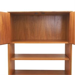 G Plan - Mid 20th century teak units, comprising tall shelving unit with cupboard sections, fall front and open shelves, together with a low twin-door cupboard unit, on plinth bases

Low unit: H 53cm, D 46cm, W 81cm
Tall unit: H 199cm, D 46cm, W 76cm