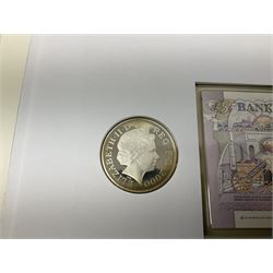 Four coin covers, comprising 2000 'The Queen Mother's 100th Birthday Silver Coin & Banknote Cover' limited edition 56/500, 2000 'Charles Darwin Commemorative Coin & Banknote Cover' limited edition 68/500, 2001 'Celebrating the 100th Birthday of Her Majesty The Queen Mother' containing  a 1999 silver one pound coin and 2001 'Royal Navy Submarines 100th Anniversary Cover' containing 2001 Turks & Caicos Islands 20 crowns silver coin