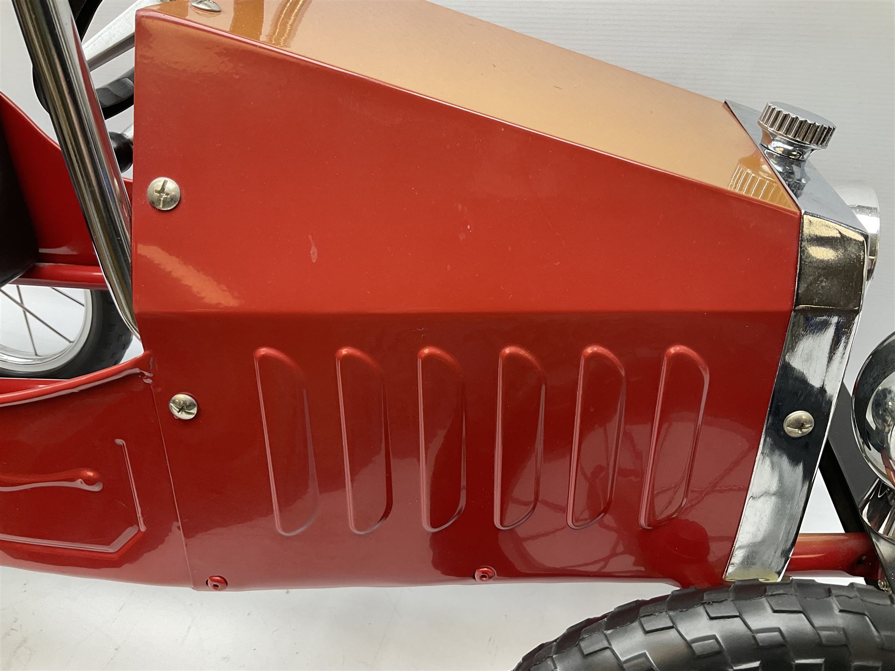 Red child's tin-plate pedal car with chrome detail, by Posh Paddles, Scarborough, H56cm, L80cm